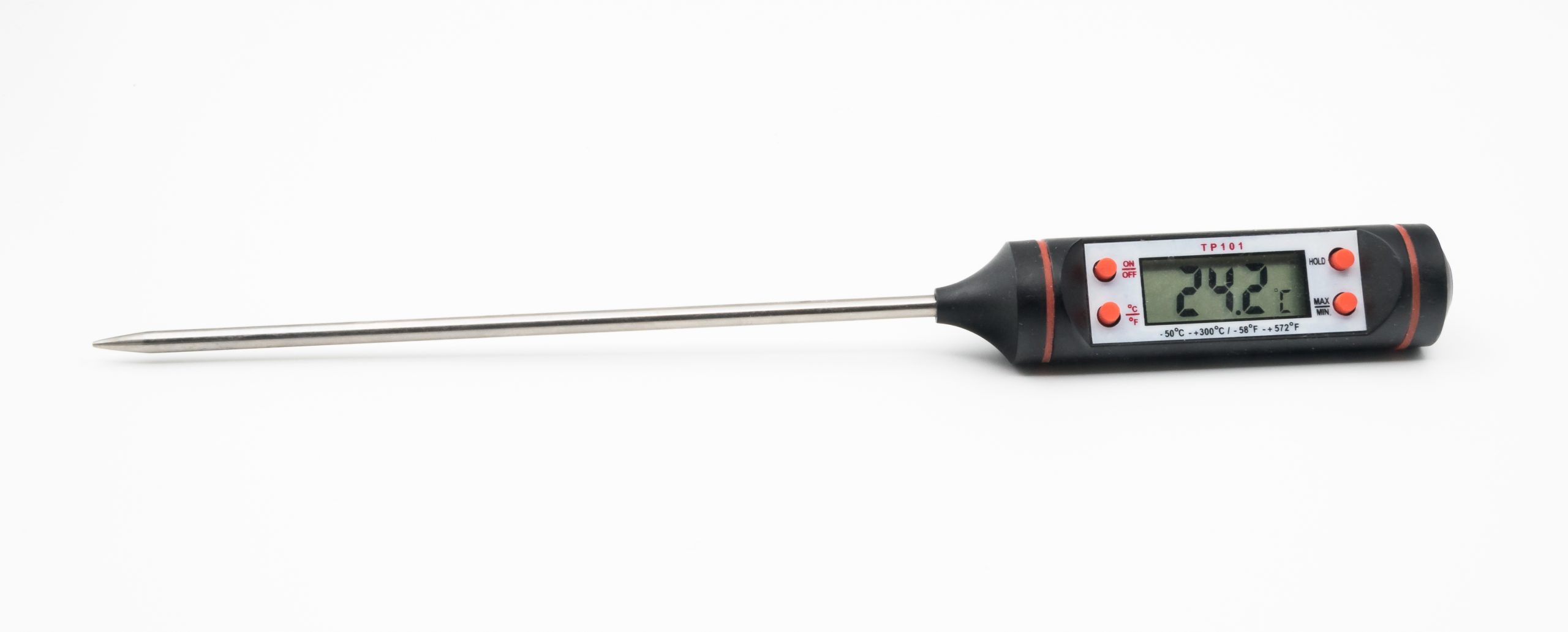 A digital probe food thermometer with a long stainless steel stem on a white background